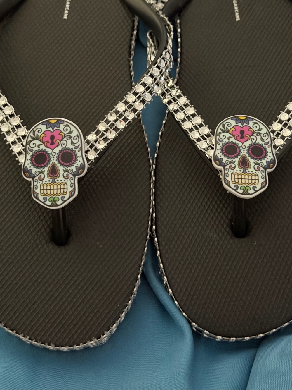 Women's Black Rhinestone Skull Flip Flop Sandals